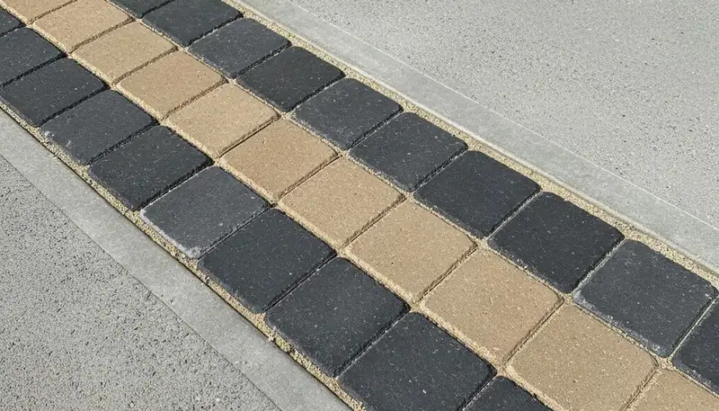 Decorative driveway paver border with clean soldier course edging by landscapers in Columbus, OH